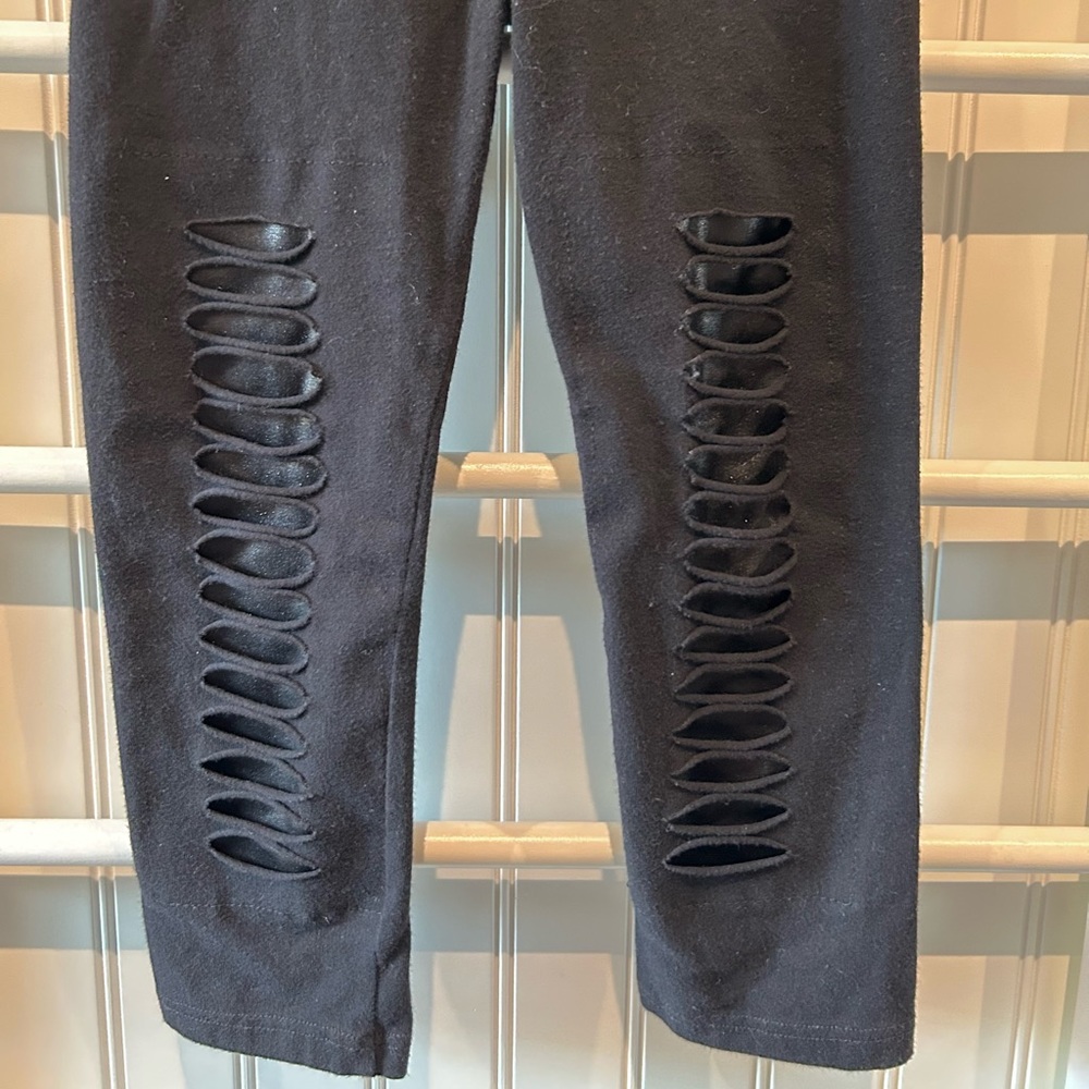 Random Hearts faux leather ripped leggings.
